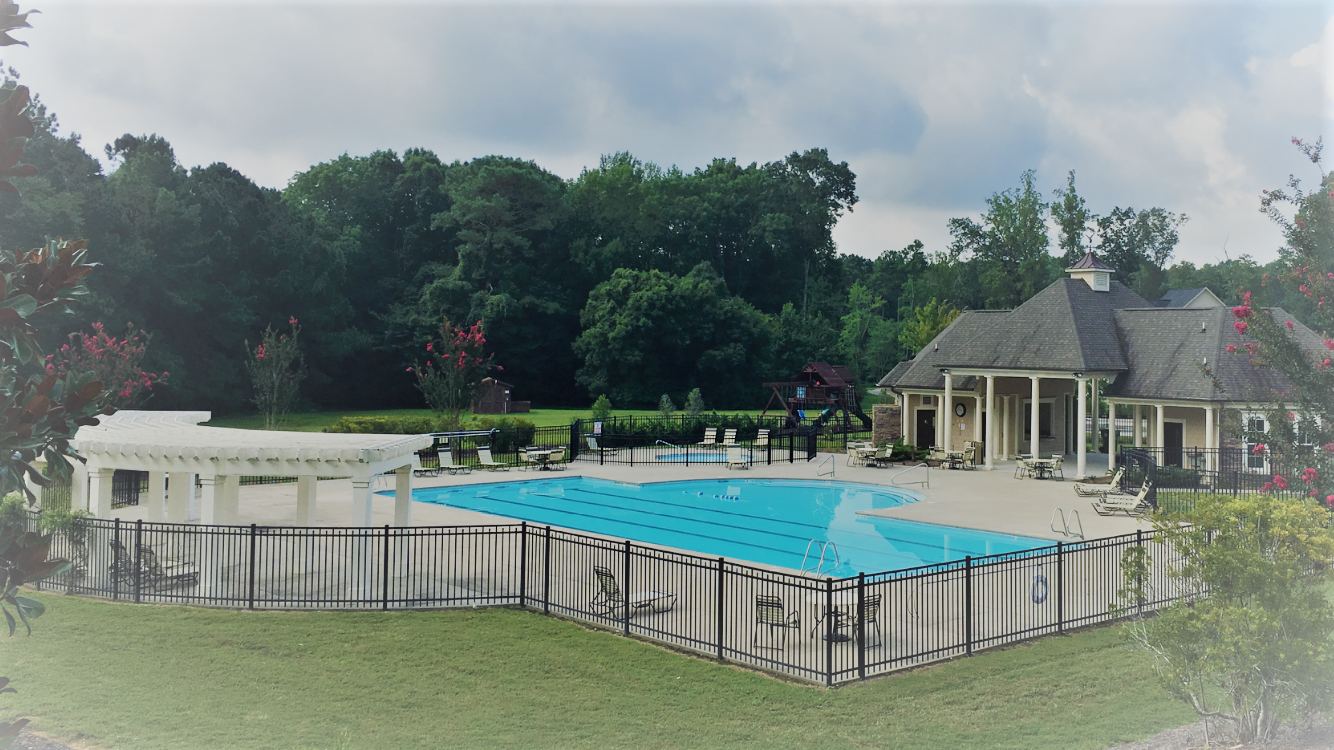 Resort style swimming pool at Banks Pointe with swim lanes and sitting area.