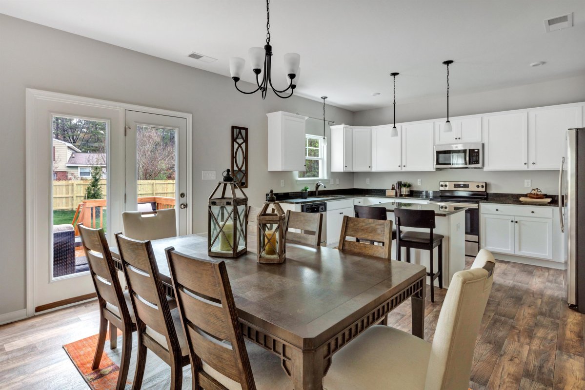 Dining area adjacent to kitchen at Central Crossing by HHHunt