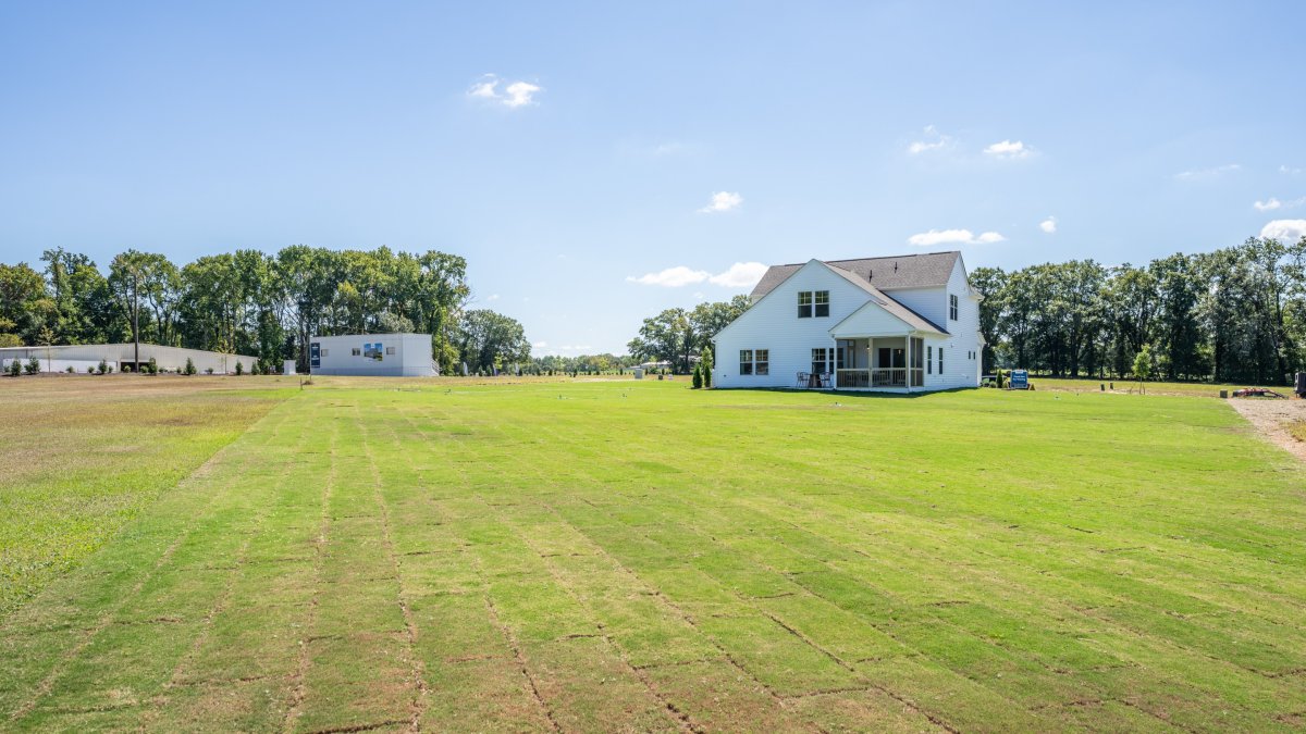 Maxwell homesite featuring a large back yard with screened porch and patio