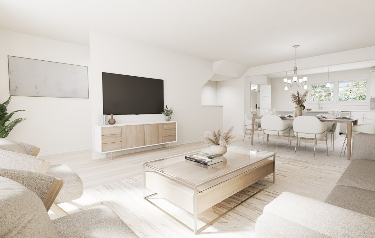 Family room in the Amherst floor plan by HHHunt Homes at Edgebrook, featuring an open living area with neutral finishes, seating area, media console, and adjoining dining space.