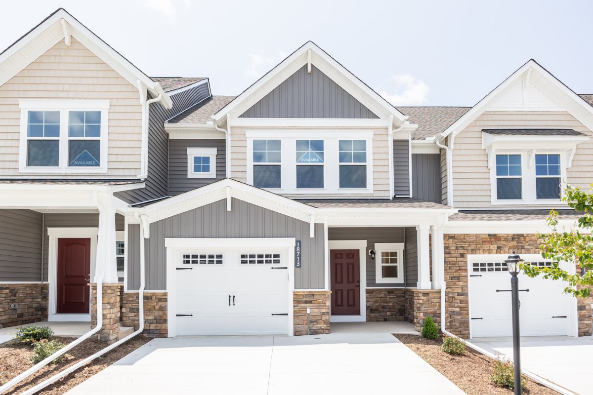 Modern exterior elevation of Davenport Plan C at 18213 Palisades Cove Trl, available now in Magnolia Green Townhomes, Richmond, Virginia, by HHH Homes Home Builder.